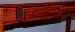 Detail carved drawer handle & dovetail drawer construction. 